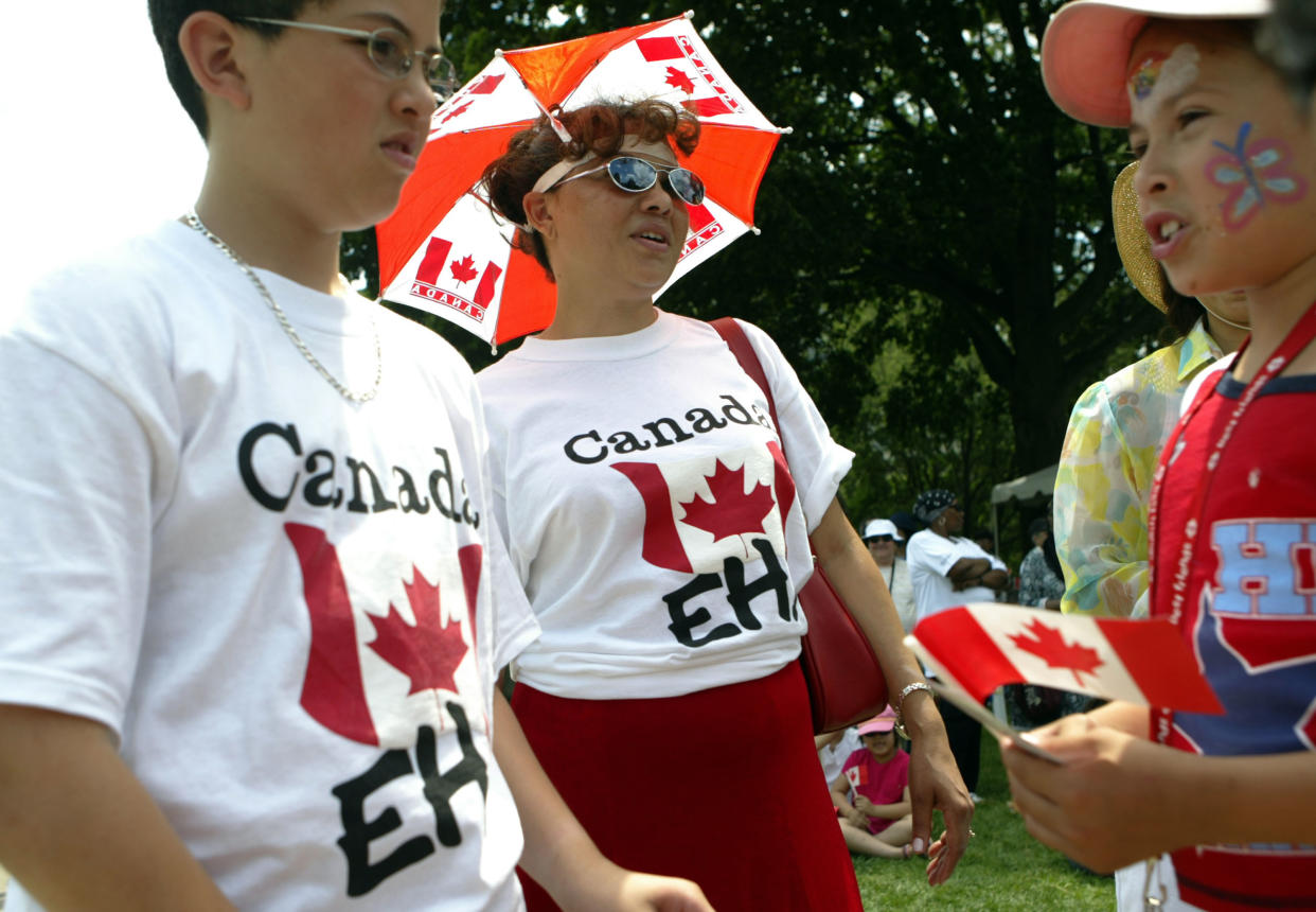 TORONTO - JULY 1:  People celebrate Canada's 138th birthday at Queen's Park on July 1, 2005 in Toronto, Canada. July 1st, known as Canada Day, celebrates the day the Canadian government was created.  (Photo by Donald Weber/Getty Images)