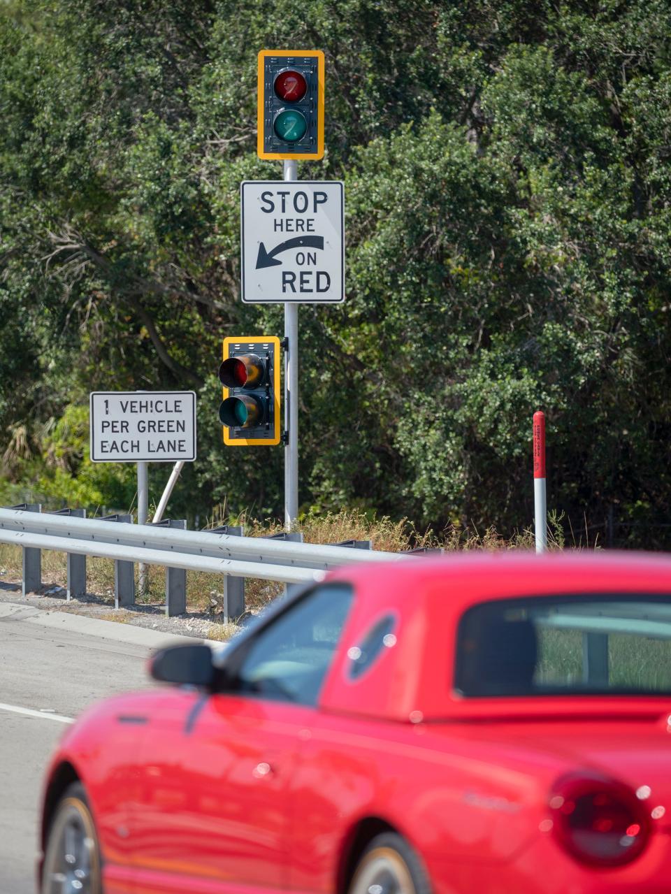 FDOT ramp signal beacons where motorists enter the southbound I95 entrance ramp from Glades Road on June 7, 2024 in Boca Raton, Florida. Traffic flow will be metered and the lights will be flashing add peak times to improve traffic flow. The signals are being installed in Palm Beach and Broward counties as part of the FDOT I95 express lane project.