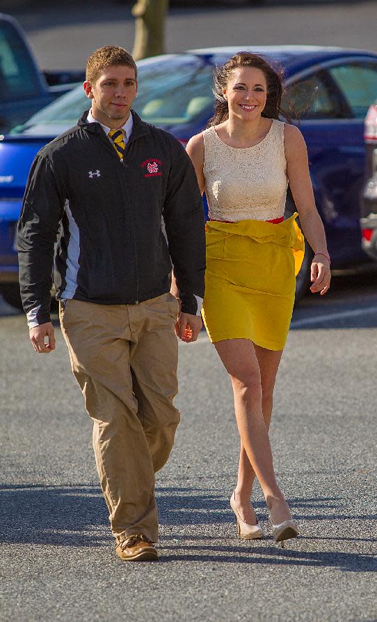 Melissa King, right, and boyfriend David Stour arrive at the Ocean City, Md., Courthouse Monday April 22, 2013. King who resigned as Miss Delaware Teen USA after an online porn video surfaced was given a year of probation Monday for underage alcohol possession in Maryland. (AP Photo/The Wilmington News-Journal, ) NO SALES THE NEWS JOURNAL/ROBERT CRAIG