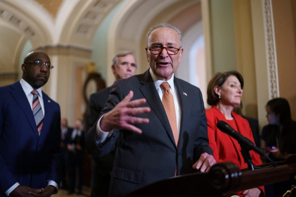 Senate Majority Leader Chuck Schumer, D-N.Y., flanked by Sen. Raphael Warnock, D-Ga., left, and Sen. Amy Klobuchar, D-Minn., speaks with reporters before a key test vote on the For the People Act, a sweeping bill that would overhaul the election system and voting rights, at the Capitol in Washington, Tuesday, June 22, 2021. (AP Photo/J. Scott Applewhite)