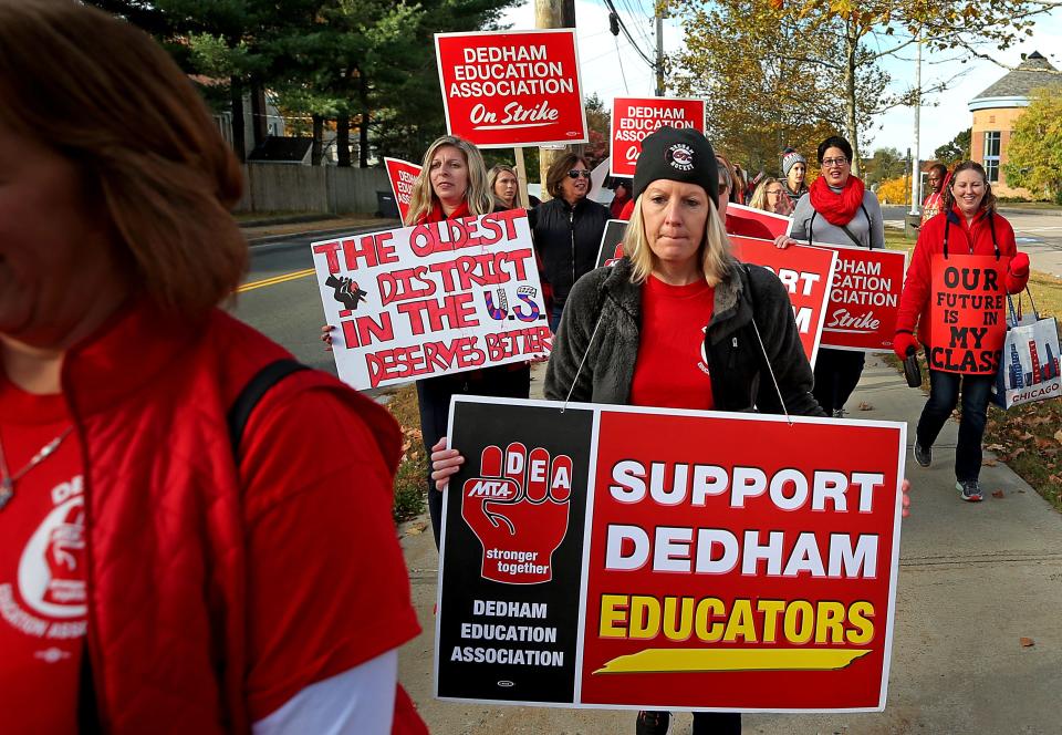 Teachers picket outside Dedham Middle School in Dedham, MA on Oct. 25, 2019.