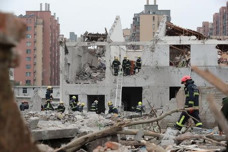 Rescue workers work at the site of a blast in Ningbo, Zhejiang province, China November 26, 2017. REUTERS/Stringer