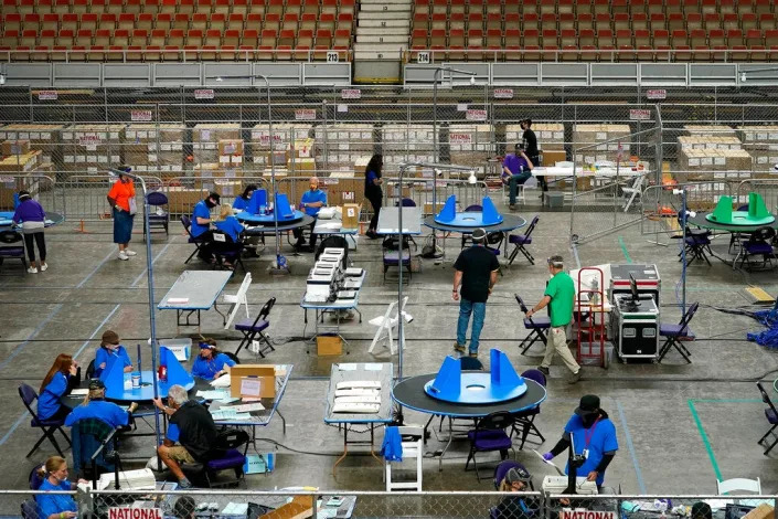 Maricopa County, Ariz., ballots cast in the 2020 general election are examined and recounted by contractors working for Florida-based company, Cyber Ninjas, in Phoenix on May 6, 2021. At least one recount will be on tap in Arizona after the counting from the Nov. 8, 2022, midterm elections ends.