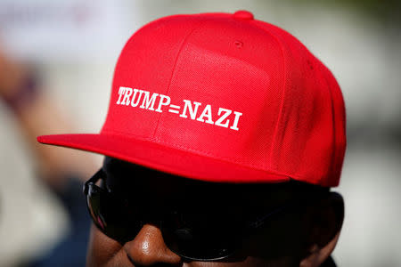 A demonstrator wears a hat in protest of Donald Trump during the California Republican Convention in Burlingame, California, April 29, 2016. REUTERS/Stephen Lam