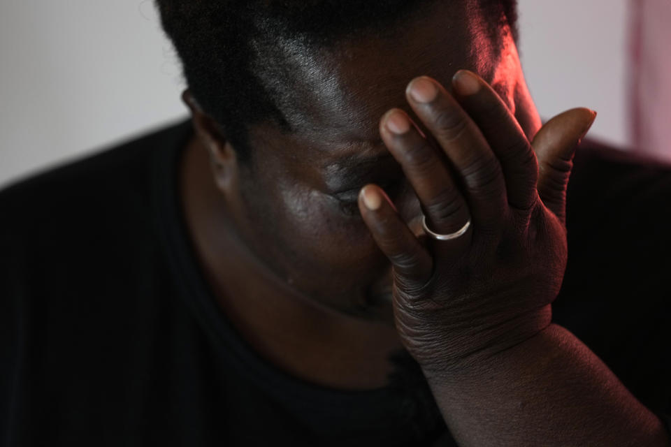 Charity Oriakhi, widow of a street vendor Alika Ogochukwu, cries during an interview with Associated Press at her home in San Severino Marche, Italy, Friday, Aug. 5, 2022. The brutal killing of a Nigerian immigrant in broad daylight has sparked a debate in this well-to-do Adriatic beach community over whether the attack by an Italian man with a court-documented history of mental illness was racially motivated. It will go to the streets on Saturday, Aug. 6 when a Black Italian activists from all over Italy march through the town demanding justice for Alika Ogorchukwu. (AP Photo/Antonio Calanni)