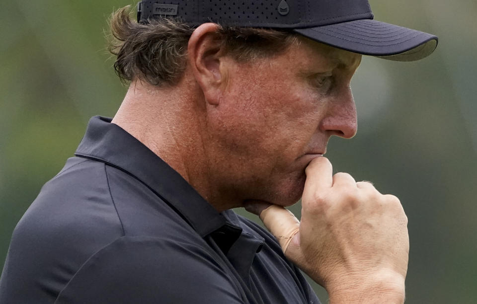 Phil Mickelson, of the United States, waits to putt on the 15th green during the first round of the US Open Golf Championship, Thursday, Sept. 17, 2020, in Mamaroneck, N.Y. (AP Photo/Charles Krupa)