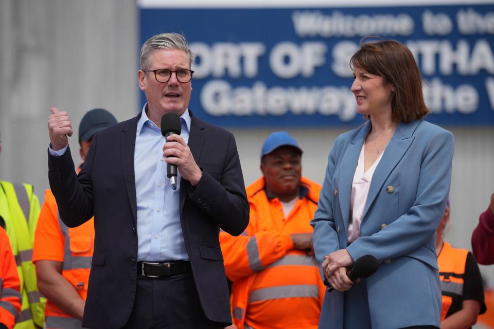 Keir Starmer with shadow chancellor Rachel Reeves during a general election campaign event at Southampton Docks (AP)