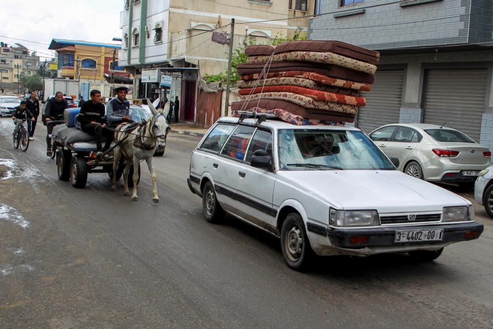 Palestinians leave Rafah by donkey and car to a ‘humanitarian zone’ in a move human rights groups claim is illegal (Reuters)