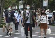 People wear face masks to protect against the spread of the coronavirus in Taipei, Taiwan, Saturday, May 30, 2020. (AP Photo/Chiang Ying-ying)