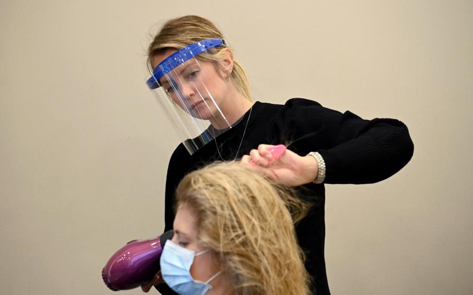 Face shields have become standard in hair salons since lockdown - Karwai Tang