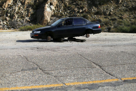 An abandoned car sits off the side of a road near Jacumba, California, United States, October 7, 2016. REUTERS/Mike Blake