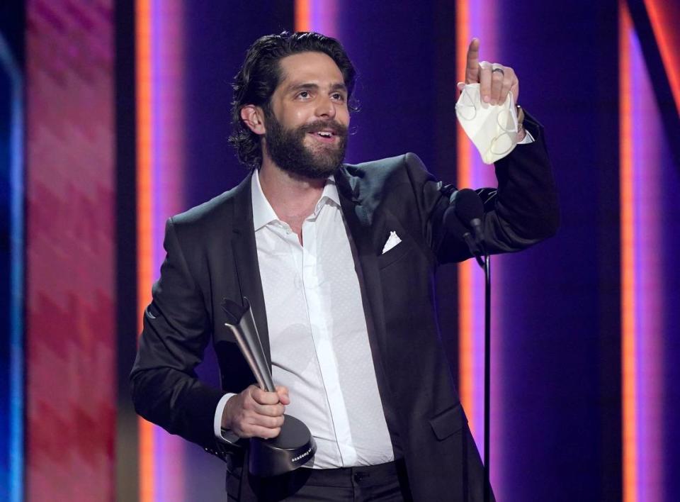 Thomas Rhett accepts the award for male artist of the year at the 56th annual Academy of Country Music Awards on Sunday night at the Grand Ole Opry in Nashville, Tenn.