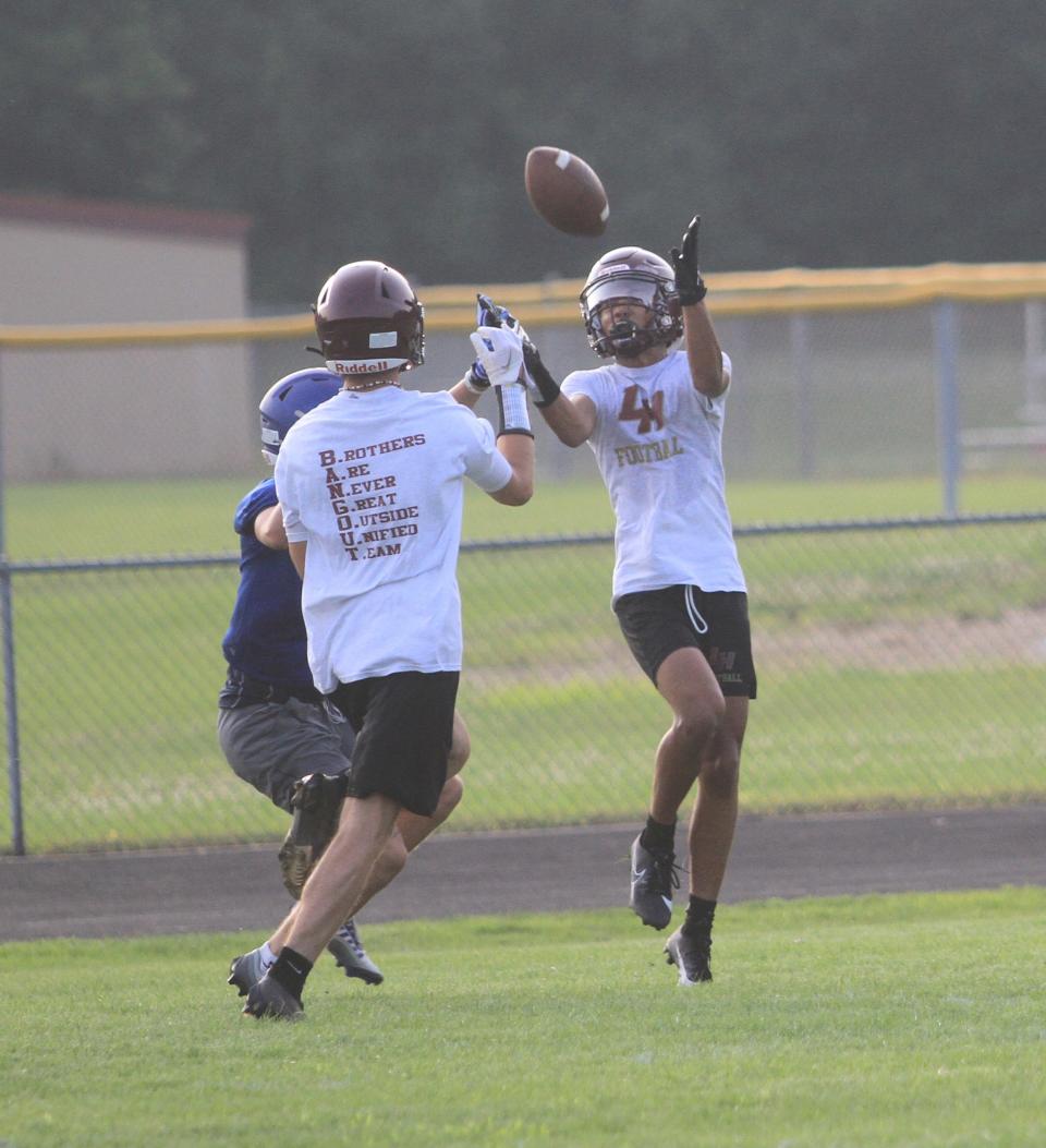 Licking Heights' J.J. Shackleford jumps up to catch a touchdown during a passing scrimmage against visiting Chillicothe on Tuesday, July 25, 2023.