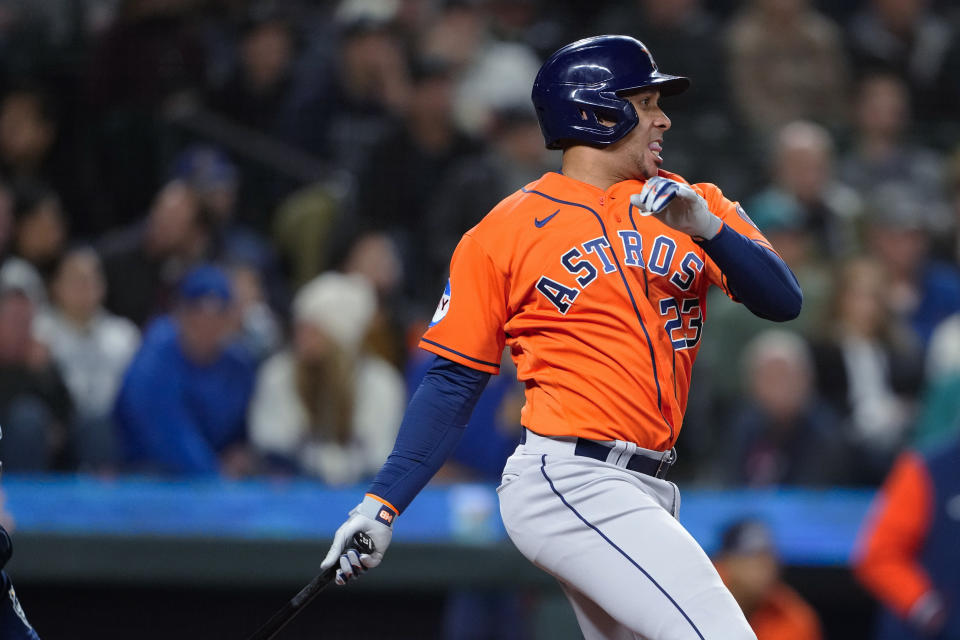 Houston Astros' Michael Brantley follows through on an RBI single against the Seattle Mariners during the seventh inning of a baseball game Wednesday, Sept. 27, 2023, in Seattle. (AP Photo/Lindsey Wasson)