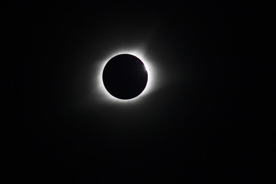 A total eclipse of the sun occurs when the moon passes between Earth and the sun, briefly blocking the sun from view. / Credit: Will Powers/SOPA Images/LightRocket via Getty Images
