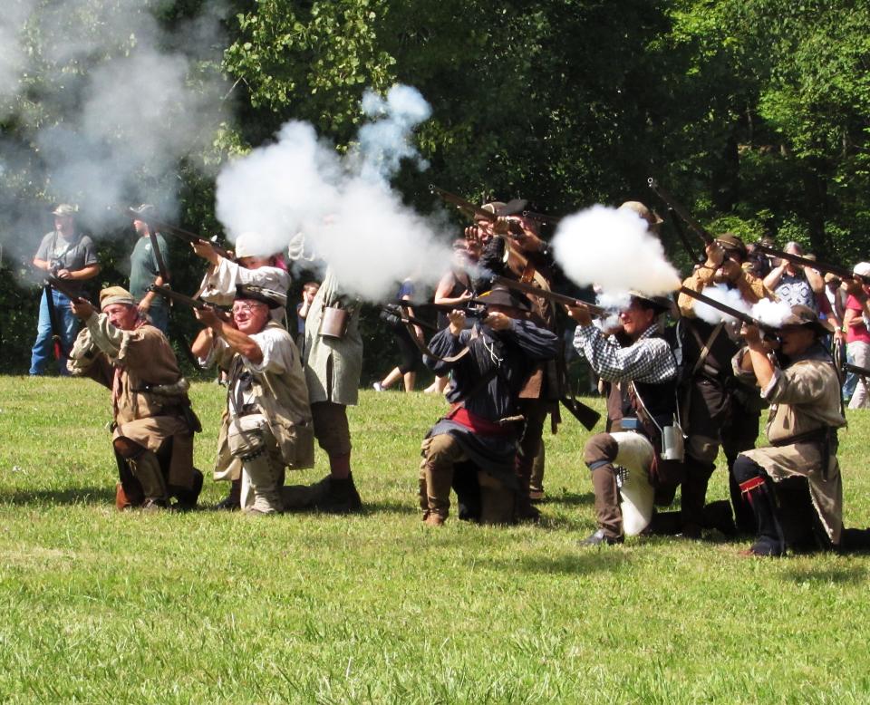 Reenactors stage a skirmish during a previous Revolutionary War weekend at Newtown Battlefield State Park.