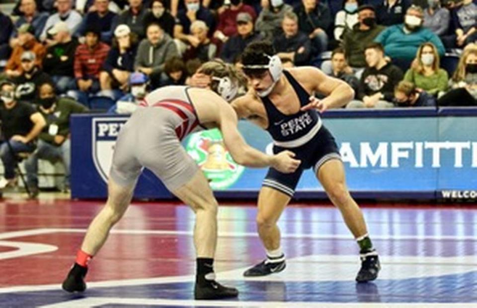 Penn State’s Beau Bartlett mixes it up for position with Penn’s Anthony Artalona in their 149-pound bout during the Nittany Lions’ 20-16 win on Friday. Bartlett edged Artalona 4-3 in ultimate tiebreaker No. 2, which was one of two key wins Penn State needed.