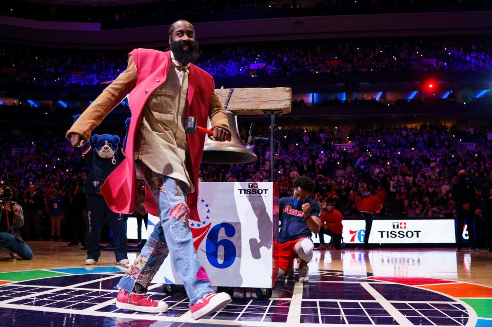 Philadelphia 76ers' James Harden reacts to ringing the bell before the team's NBA basketball game against the Boston Celtics, Tuesday, Feb. 15, 2022, in Philadelphia. (AP Photo/Chris Szagola)