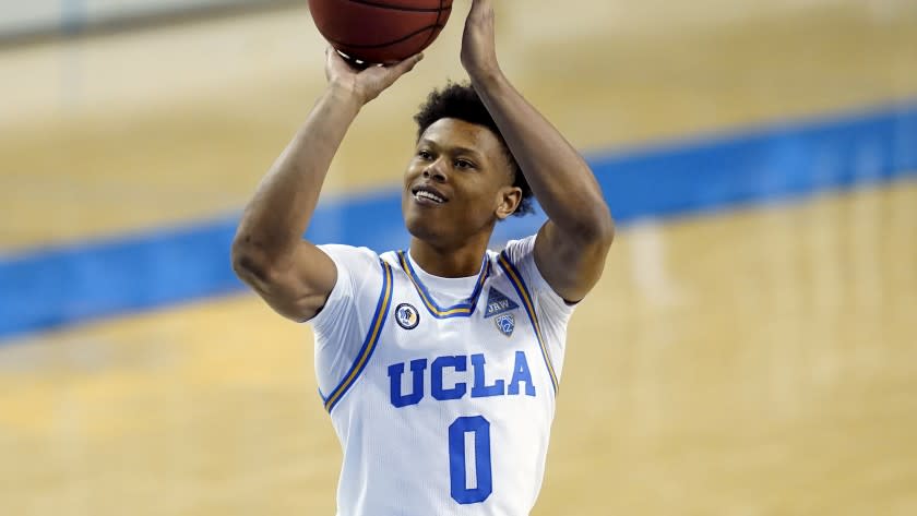UCLA guard Jaylen Clark (0) takes a shot during the second half of an NCAA college basketball game against Washington Saturday, Jan. 16, 2021, in Los Angeles. (AP Photo/Ashley Landis)