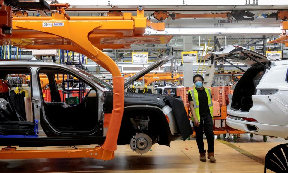 <span>A Stellantis worker on the assembly line for the Jeep Grand Cherokee L model in Detroit, US.</span><span>Photograph: Rebecca Cook/Reuters</span>