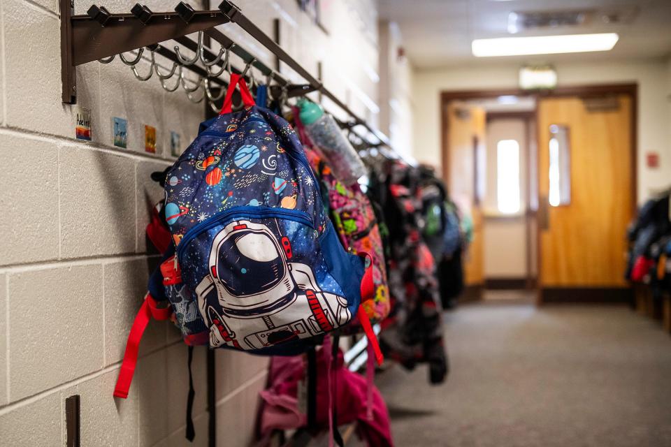 Backpacks line a Northern Colorado elementary school hallway in this file photo.