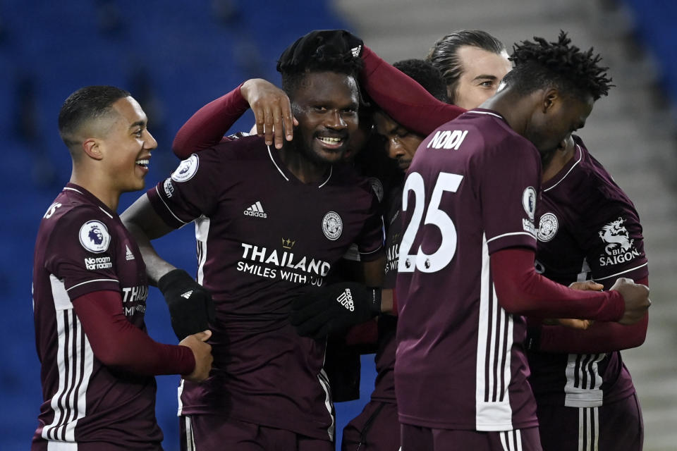 Leicester's Daniel Amartey, 2nd right, is congratulated by his teammates after scoring his side's second goal during the English Premier League soccer match between Brighton & Hove Albion and Leicester City at the AMEX Stadium in Brighton, England, Saturday, March 6, 2021. (Neil Hall/Pool via AP)