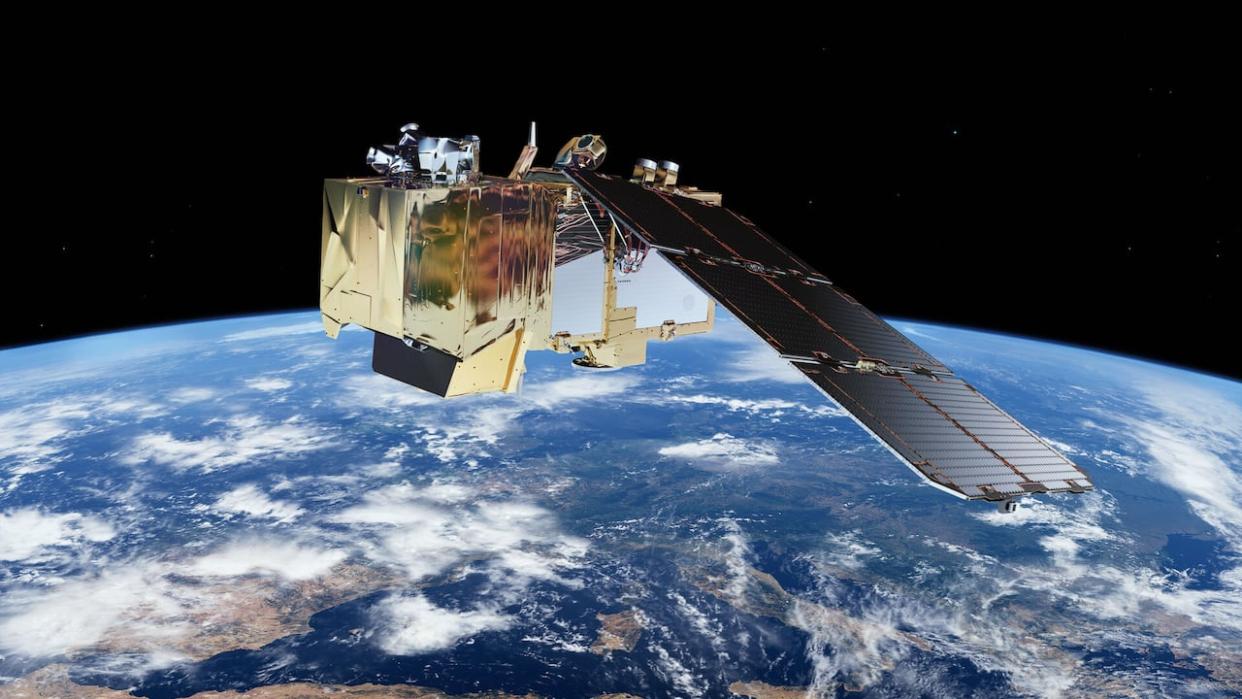 In an illustration, the European Space Agency's Copernicus Sentinel-2 satellite is depicted orbiting the Earth. Canada currently relies on its instruments to monitor and predict wildfire behaviour from space. But the Canadian Space Agency wants to launch its own dedicated wildfire satellite. (Submitted by ESA - image credit)