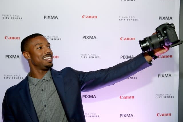 AUSTIN, TX - OCTOBER 01:  Actor Michael B. Jordan takes a selfie with a Canon at the Canon PIXMA PRO City Senses Galary at Austin Music Hall in Austin on October 1, 2014.  (Photo by Tasos Katopodis/Getty Images for Canon)