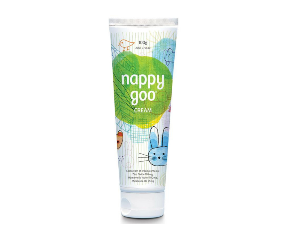 A white, green and blue tube of Nappy Goo nappy cream against a white background.
