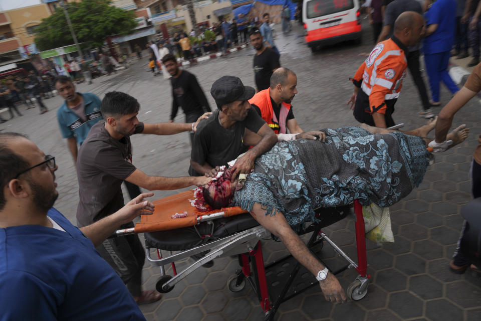 Palestinian wounded in Israeli bombardment is brought to a hospital in Deir al Balah, south of the Gaza Strip, Friday, Oct.27, 2023. ( AP Photo/Hatem Moussa)