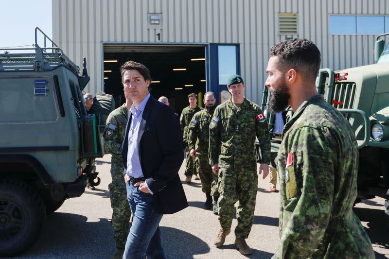 Canada's Prime Minister Justin Trudeau speaks with Canadian Forces personnel