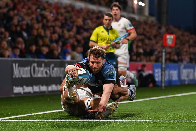 Thomas Young of Cardiff dives for the try line before being denied