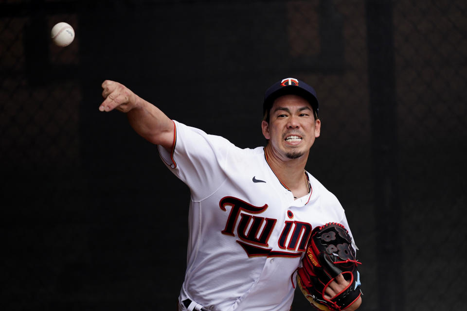 Minnesota Twins starting pitcher Kenta Maeda (18) warms up in the bullpen before a spring training baseball game against the Boston Red Sox Sunday, March 14, 2021, in Fort Myers, Fla.. (AP Photo/John Bazemore)