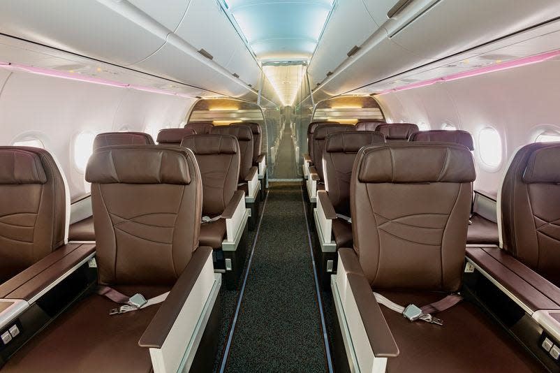 A321 Hawiian Airlines plane interior, brown leather seats