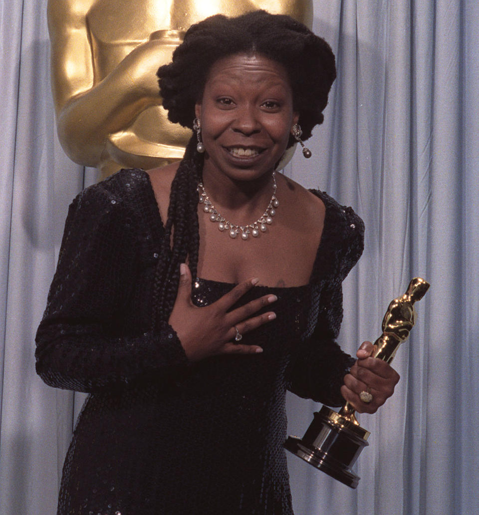 Whoopi Goldberg holds her Oscar for Best Supporting Actress, won for her role in 