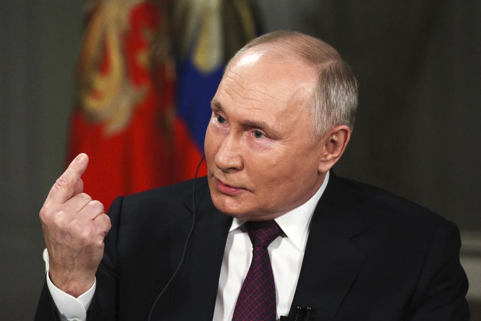 FILE - In this photo released by Sputnik news agency on Friday, Feb. 9, 2024, Russian President Vladimir Putin gestures while speaking during an interview with former Fox News host Tucker Carlson at the Kremlin in Moscow, Russia, Tuesday, Feb. 6, 2024. When former Fox News host Tucker Carlson last week asked Vladimir Putin about his reasons for sending troops into Ukraine two years ago, Putin gave him a lecture on Russian history, arguing that Ukrainians and Russians historically have always been one people, and that Ukraine's sovereignty is merely an illegitimate holdover from the Soviet era. In Russia, history has long become a propaganda tool used to advance the Kremlin's political goals. (Gavriil Grigorov, Sputnik, Kremlin Pool Photo via AP, File)