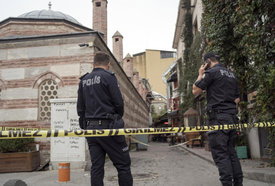 Police forensic officials work at the site after former British army officer who helped found the "White Helmets" volunteer organization in Syria, James Le Mesurier's body was found in Istanbul, early Monday Nov. 11, 2019. Turkish officials and news reports said Monday that Le Mesurier's body was found near his home in Istanbul's Beyoglu district by worshippers on their way to a mosque to pray. (AP Photo/Emrah Gurel)