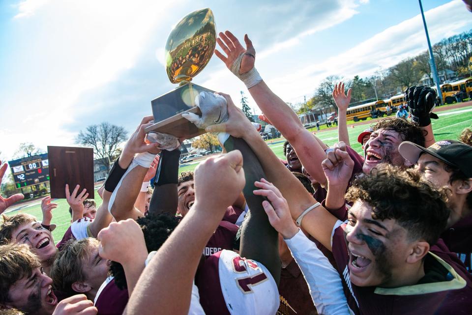 James I. O'Neill celebrates their win after the Section 9 Class C championship in Newburgh on Saturday. O'Neill defeated Burke 42-6.