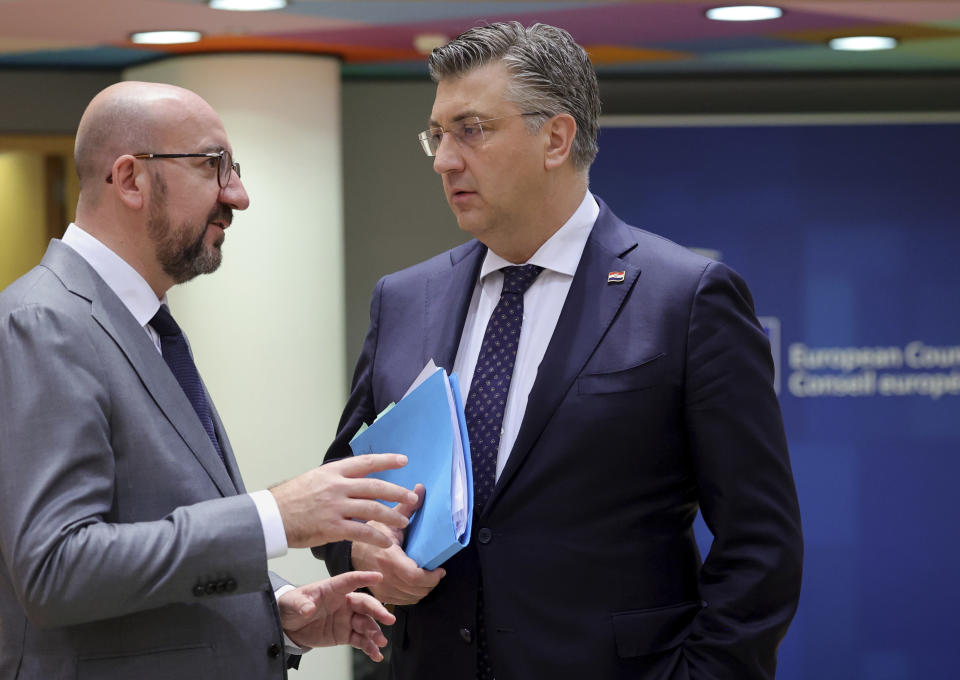 European Council President Charles Michel, left, speaks with Croatia's Prime Minister Andrej Plenkovic during a round table meeting at an EU summit in Brussels, Friday, June 24, 2022. EU leaders were set to discuss economic topics at their summit in Brussels Friday amid inflation, high energy prices and a cost of living crisis. (AP Photo/Olivier Matthys)