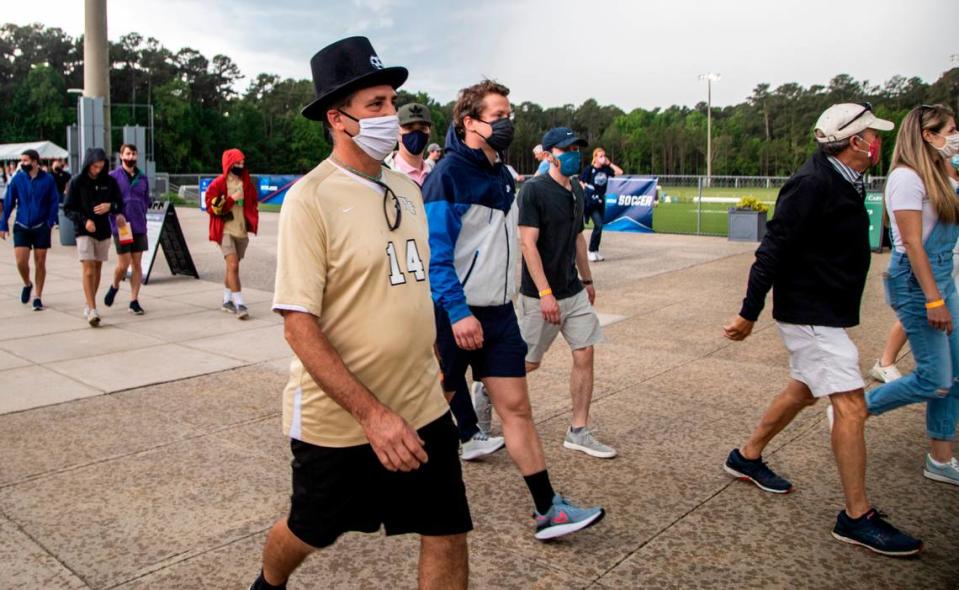 Fans attending the Wake Forest UNC-Chapel Hill’s game head to their cars durning a lightning delay during the Division I Men’s Soccer Championship quarterfinals at WakeMed Soccer Park in Cary Monday, May 10, 2021.