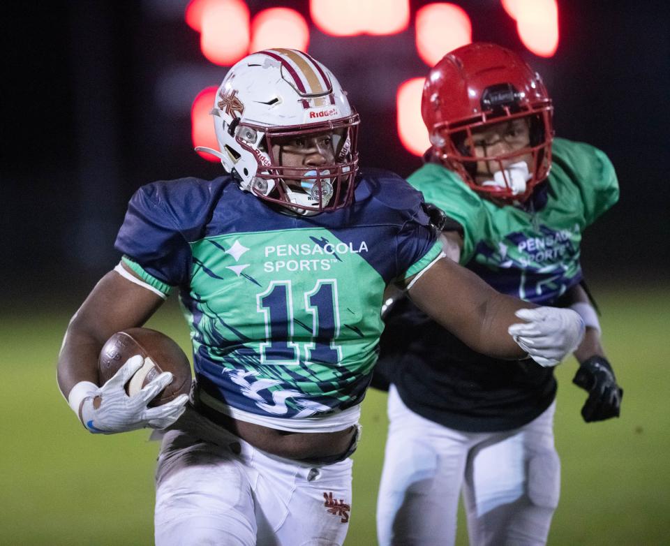 Jamarkus Jefferson (11), of Northview High School, carries the ball during the Pensacola Sports' All-Star Football Game at Booker T. Washington High School in Pensacola on Friday, Dec. 16, 2022.