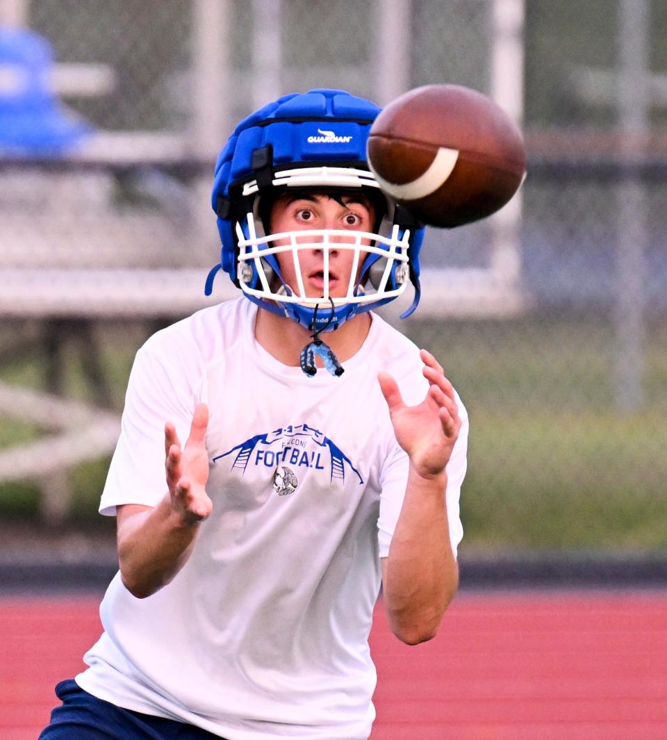 Mashpee receiver Logan Wills takes in a throw during a recent practice session.
