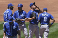 Kansas City Royals pitcher Kris Bubic, middle right, reacts on the mound during the second inning of a baseball game against the Oakland Athletics in Oakland, Calif., Sunday, June 13, 2021. (AP Photo/Jeff Chiu)