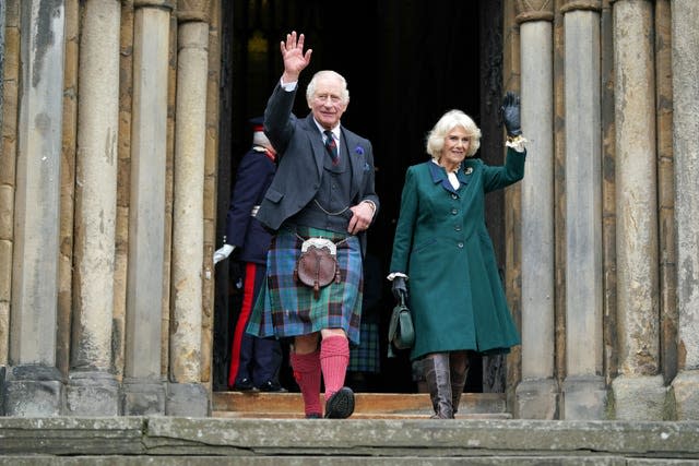 King Charles III and the Queen Consort wave as they leave Dunfermline Abbey, after a visit to mark its 950th anniversary, and after attending a meeting at the City Chambers in Dunfermline, Fife, where the King formally marked the conferral of city status on the former town 