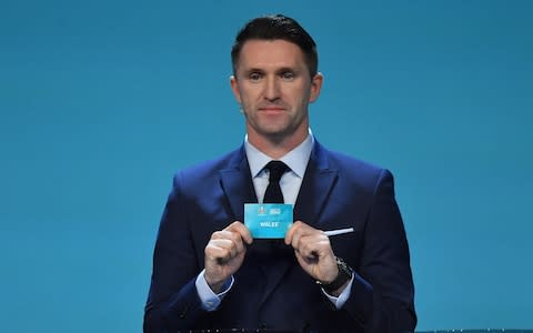 Former Republic of Ireland international Robbie Keane draws out the name of Wales during the UEFA Euro 2020 Draw - Credit: Getty Images