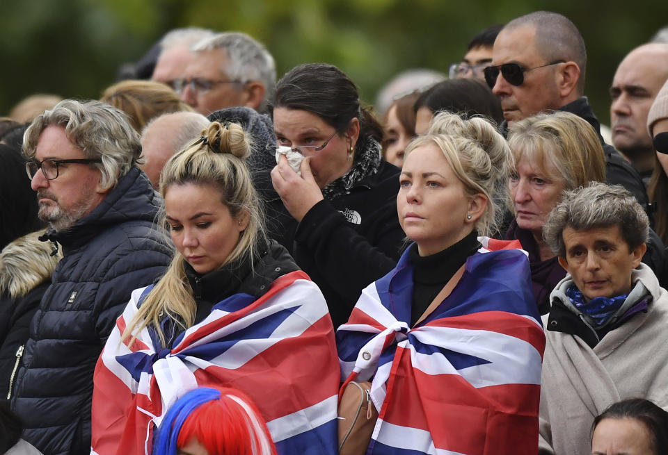 Mourners get emotional at Westminster Abbey before the State Funeral Service of Britain's Queen Elizabeth II, Monday, Sept. 19, 2022, in London. (Anthony Devlin/Pool Photo via AP)