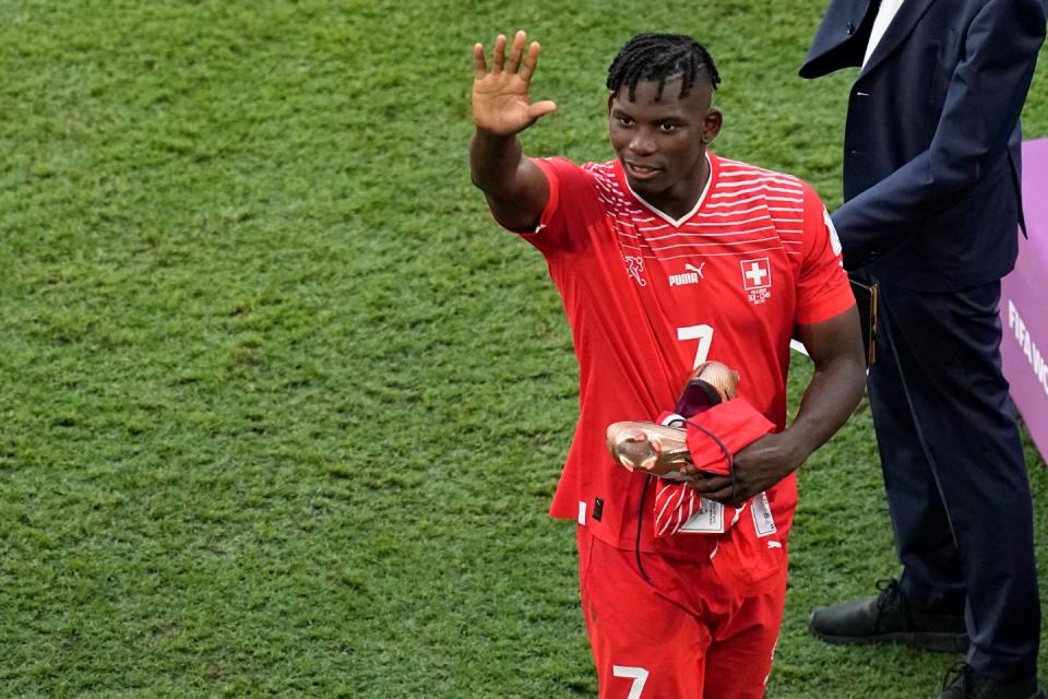 Switzerland's Breel Embolo greets supporters at the end of during the World Cup group G football match between Switzerland and Cameroon, at the Al Janoub Stadium in Al Wakrah, Qatar, Thursday, Nov. 24, 2022. (AP Photo/Ebrahim Noroozi)