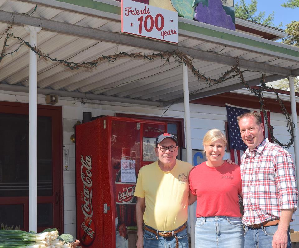 From left, John Gordon and Kerri and Paul Corderman welcome patrons to Gordon's Grocery in Hagerstown's North End. Gordon's celebrates 100 years in business this month.