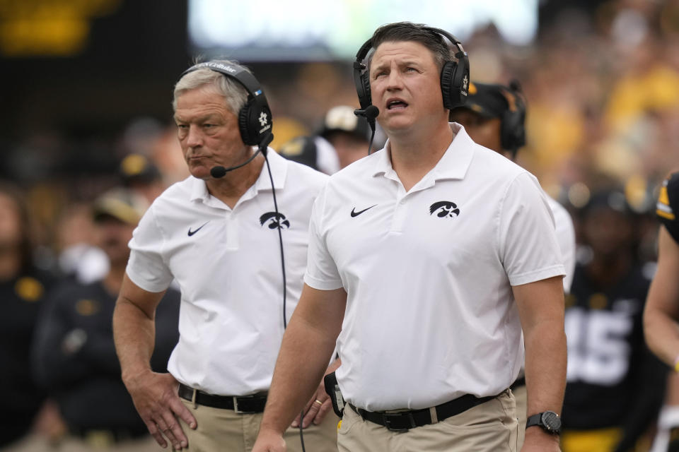 FILE - Iowa offensive coordinator Brian Ferentz and head coach Kirk Ferentz, left, watch from the sideline during the first half of an NCAA college football game against Western Michigan, Saturday, Sept. 16, 2023, in Iowa City, Iowa. Brian Ferentz will be out as Iowa's offensive coordinator at the end of the season, interim athletic director Beth Goetz announced Monday, Oct. 30. (AP Photo/Charlie Neibergall, File)