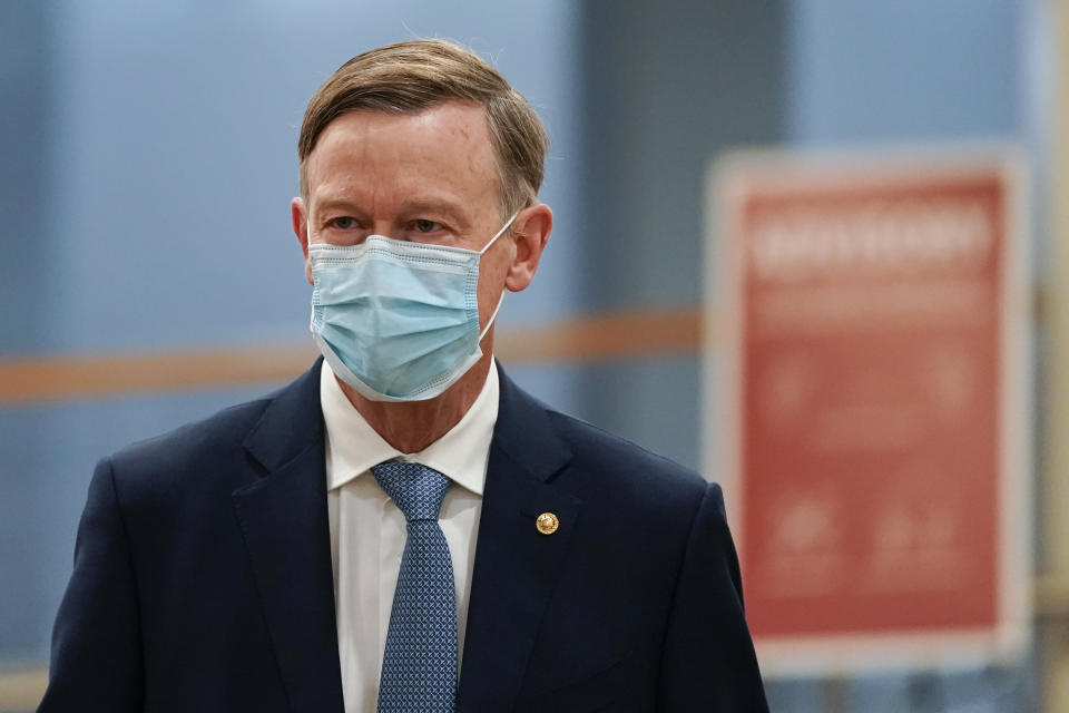 Sen. John Hickenlooper, D-Colo., arrives on Capitol Hill in Washington, Saturday, Feb. 13, 2021, on the fifth day of the second impeachment trial of former President Donald Trump. (AP Photo/Alex Brandon)